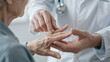 © MiMoShi - rheumatologist checking elderly finger joints arthritis inflammation medical diagnosis