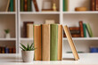 © Pixel-Shot - Books with plant on table in home library, closeup