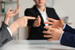© Pixel-Shot - Hands of arguing clients at mediator's office, closeup