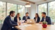 © CuteBee - A focused group of five diverse business professionals are engaged in a collaborative discussion around a modern conference table in a well-lit office.