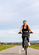 © Barillo_Images - Healthy lifestyle woman cycling outdoors in summer