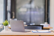 © David - Empty workspace, no people, office desk, with laptop, calculator, graphs, documents on the table.