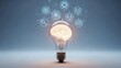 © Yuliia - Light bulb with glowing brain inside surrounded by floating technology icons representing innovation, creativity and digital transformation concepts.