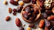 © w - Close up of dates and nuts composition on a white surface