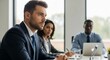 © Ruhul Amin   - Three diverse professionals in suits in a bright office meeting, one man in foreground, business concept