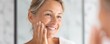 © AGI Studio - A smiling woman gently touching her face, reflecting a positive attitude and self-care in a well-lit environment.