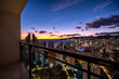 © yaqui_villegas - benidorm spain mediterranean balcony terrace overlooking skyline cityscape at twilight as lights appear along the horizon above the sea