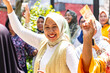 © ADDICTIVE STOCK - Women enjoying street karaoke in Indonesian city