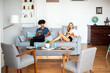© ADDICTIVE STOCK - Relaxed couple enjoying leisure time at home