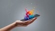 © Muhasnumay - Color Explosion on Digital: A hand delicately cradles a sleek digital device, its screen erupting with a vibrant splash of colors, symbolizing creativity and the intersection of technology and art.