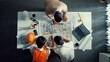 © InfiniteFlow - Top down aerial view of smart architect engineer team pointing and discussing about building construction. Group of diverse people working together to plan and design by using blueprint. Alimentation.
