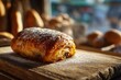 © Olena - Freshly baked pain au chocolat photographed in a warm bakery setting, buttery crust and rich chocolate