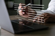 © onephoto - Electronic signature concept, businessman signs document on a laptop, secure e signing, document contract approval, identity verification