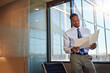© BuyoutReese05/peopleimages.com - Black man, lawyer and reading folder in office for case file, witness statement and legal documents. Attorney, review and paperwork with evidence, lawsuit investigation and agreement of court summons
