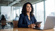 © Five Million Stock - Focused latin business woman accountant working on laptop computer reading financial contract document in office workplace. Mature manager businesswoman specialist doing paperwork using pc. Copy space