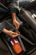 © blackday - Hands securing compression straps inside packed suitcase