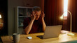 © Татьяна Епанешникова - Man worker hard work laptop home. Tired pondering guy suffer head ache pain think project over. Male employee rub temples feel bad. Busy ceo person use pc. Headache ill. Online computer freelance job.
