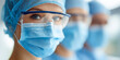 © GrayFrog - Close up portrait of a healthcare professional in surgical mask, protective goggles and medical cap in a hospital environment.