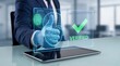 © dingraphwork  - Biometric verification on a tablet with a verified checkmark