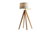© satans - A wooden tripod lamp with a cream shade emits warm light, isolated on black