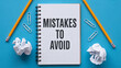 © Waqas - Notepad with mistakes to avoid text surrounded by pencils and crumpled paper notebook pencil mistake error caution warning education learning school