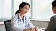 © na - Doctor consulting patient in clinic