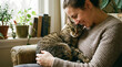 © Tim59 - Woman embracing cat in cozy living room indoor lifestyle warm atmosphere joyful bonding moment