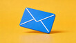 © Imagin  - Blue 3D Email Envelope Icon on Yellow Background