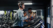 © peopleimages.com - Fitness, running or man with headphones on treadmill in gym, streaming music or cardio workout for health. Performance, exercise machine or athlete with audio tech to listen, training album or active