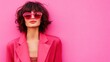 © slamet - Stylish woman in pink blazer and sunglasses vibrant color portrait