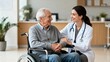 © Sandra - Elderly man in wheelchair with female doctor