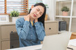 © KMPZZZ - Body muscles hurt stiff, face suffering asian young woman, girl neck pain, body ache while sitting work at home, holding massaging rubbing back, problem health care of office syndrome people concept.