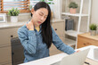 © KMPZZZ - Body muscles hurt stiff, face suffering asian young woman, girl neck pain, body ache while sitting work at home, holding massaging rubbing back, problem health care of office syndrome people concept.