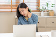 © KMPZZZ - Body muscles hurt stiff, face suffering asian young woman, girl neck pain, body ache while sitting work at home, holding massaging rubbing back, problem health care of office syndrome people concept.