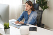 © Pormezz - Air Humidifier Device At home and Woman relaxing during work