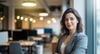 © TechVision Studio - Woman in a grey blazer standing confidently with arms crossed in a contemporary office, soft lighting, business, modern
