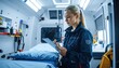 © Cumam - Dedicated Paramedic Woman Documenting Patient Information Inside Ambulance.
