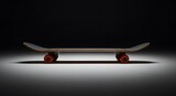 Skateboard with red wheels on black background for sports and action concept