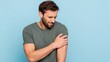 © LimeSky - Allergy signs Man rubbing arm against a light blue backdrop Area for text