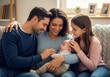© Eira - Happy family with newborn baby and older sibling on sofa