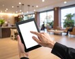© focussy - Close-up of a hand pressing on a digital tablet screen