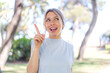 © luismolinero - Young blonde woman at outdoors intending to realizes the solution while lifting a finger up