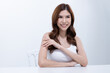 © Washburn - Smiling woman with radiant skin touching her face