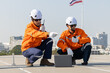 © Washburn - Engineers installing and inspecting solar panels on rooftop