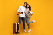 © Prostock-studio - Portrait Of Happy Young Arab Spouses Ready For Vacation, Cheerful Middle Eastern Couple Standing With Suitcase, Pasports And Travel Tickets Over Yellow Background In Studio, Full Length, Copy Space