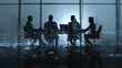 © Nuttawut - Boardroom meeting at dusk: Silhouetted business people in a modern boardroom, illuminated by cityscape lights through the panoramic window.