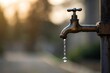 © NURDIYANNA - Vintage tap with water droplet against blurred natural background