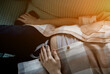 © jozzeppe777 - Pregnant woman lying on sofa at home.