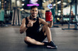 © Prostock-studio - Handsome Muscular Middle Eastern Guy Advertising Fitness Supplements While Posing At Gym, Young Arab Male Athlete Holding Red Container With Whey Protein Powder And Showing Thumb Up At Camera