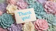 © tashechka - Colorful flowers and a thank you card on a simple table display